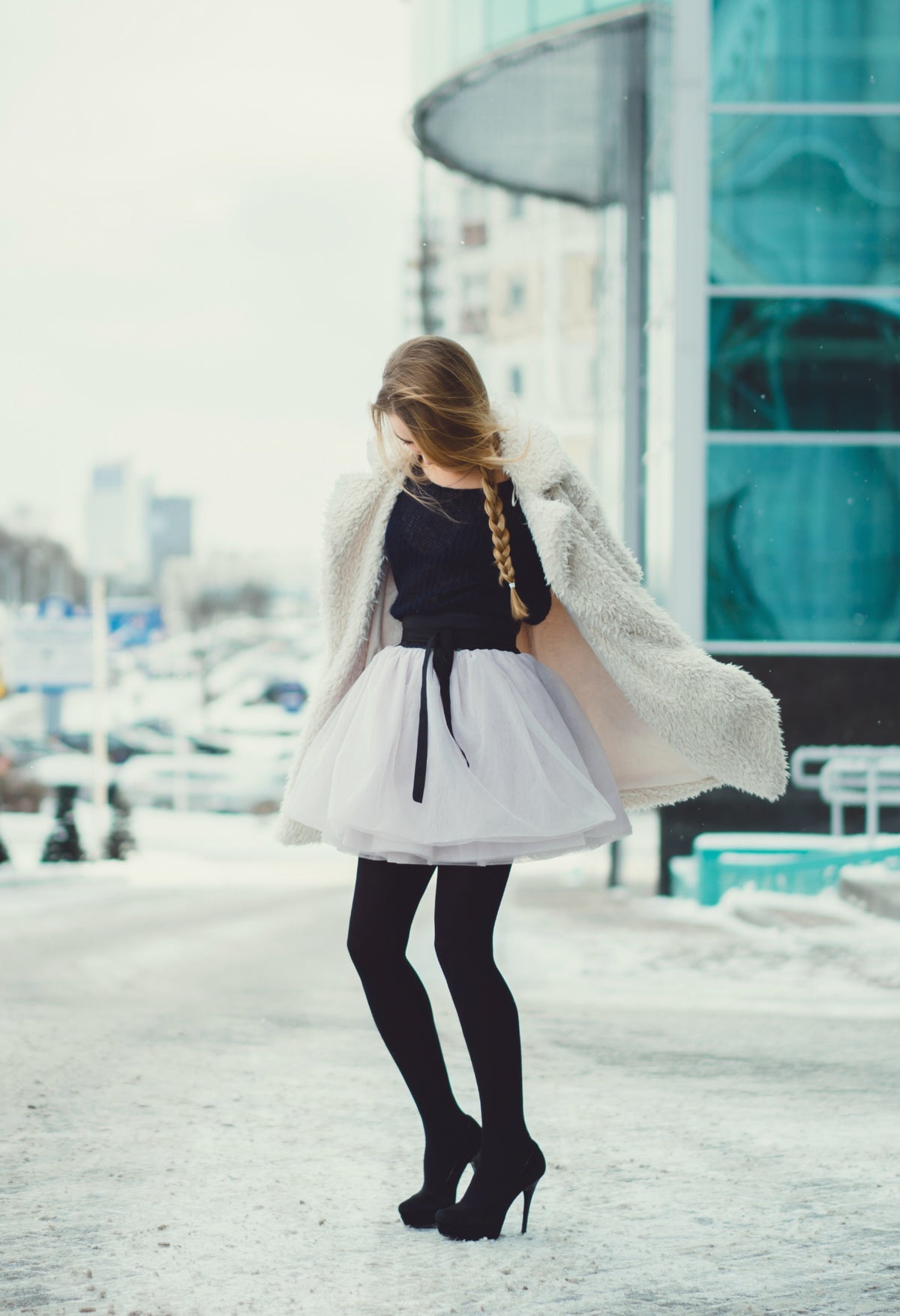 A model showing 10 trendy ways to wear a white skirt in winter