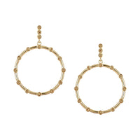 Unique statement gold hoop earrings showcasing a modern silhouette and a touch of artisanal crochet artistry.